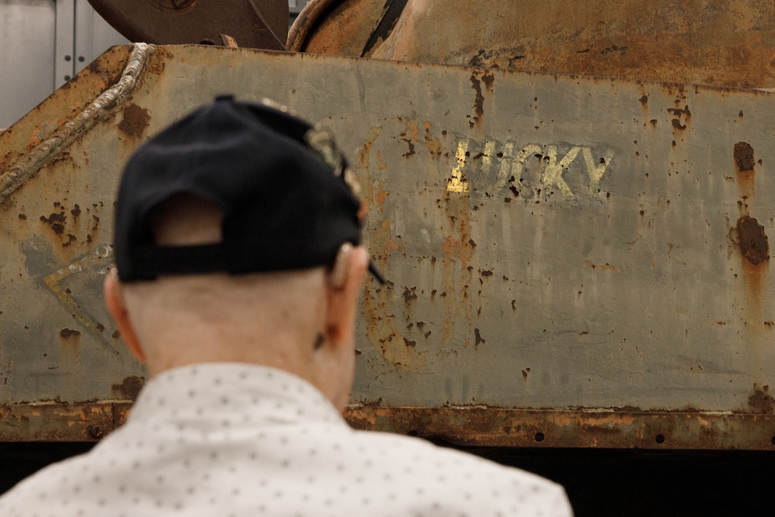 U.S. Marine Corps veteran Cpl. Leighton Willhite, who served in the Battle of Iwo Jima, views the name painted on a World War II-era Sherman Tank at the Museum Support Facility in Dumfries, Virginia.