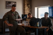 U.S. Marines with 2nd Marine Aircraft Wing, assigned to Special Purpose Marine Air-Ground Task Force 250, attend a meeting prior to takeoff at Cobb County International Airport, Kennesaw, Georgia, during Marine Week Atlanta, Aug. 31, 2025. Marines stationed across the globe commemorate the 250th anniversary of the Marine Corps, honoring a distinguished legacy of service, sacrifice, and unwavering fidelity to both the nation and the Corps. (U.S. Marine Corps photo by Sgt. Alexis French)