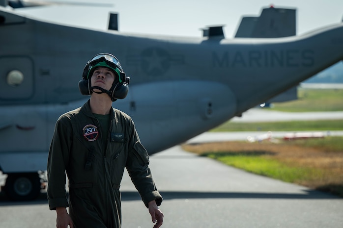 U.S. Marines Corps Sgt. Travis Cotnoir, a MV-22 Osprey crew chief, with Marine Medium Tiltrotor Squadron (VMM) 261, 2nd Marine Aircraft Wing, assigned to Special Purpose Marine Air-Ground Task Force 250, undergos pre-flight checks at Cobb County International Airport, Kennesaw, Georgia during Marine Week Atlanta, Aug. 31, 2025. Marines stationed across the globe commemorate the 250th anniversary of the Marine Corps, honoring a distinguished legacy of service, sacrifice, and unwavering fidelity to both the nation and the Corps. (U.S. Marine Corps photo by Sgt. Alexis French)
