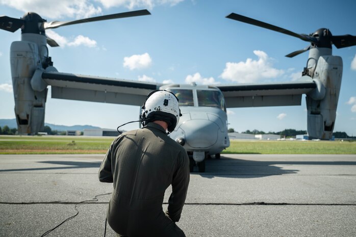 U.S. Marines Corps Cpl. Gavin McSwain, an MV-22 Osprey crew chief with 2nd Marine Aircraft Wing assigned to Special Purpose Marine Air-Ground Task Force 250, conducts pre-flight checks prior to takeoff at Cobb County International Airport, Kennesaw, Georgia, during Marine Week Atlanta, Aug. 31, 2025. Marines stationed across the globe commemorate the 250th anniversary of the Marine Corps, honoring a distinguished legacy of service, sacrifice, and unwavering fidelity to both the nation and the Corps. (U.S. Marine Corps photo by Sgt. Alexis French)