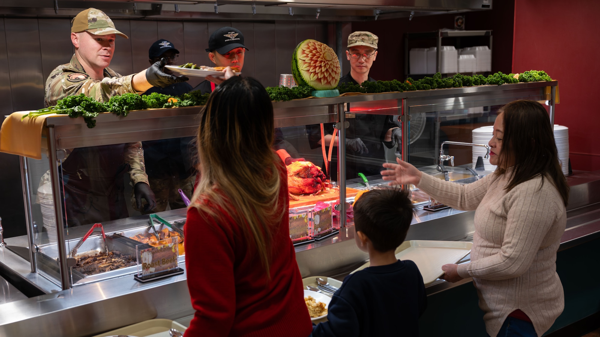 U.S. Air Force leadership serve food during a Thanksgiving event at the Gingko Dining Facility at Osan Air Base, Republic of Korea, Nov. 27, 2025. The tradition of leaders serving Airmen reflects core values and fosters connection during the holiday season. (U.S. Air Force photo by Senior Airman Rome Bowermaster)