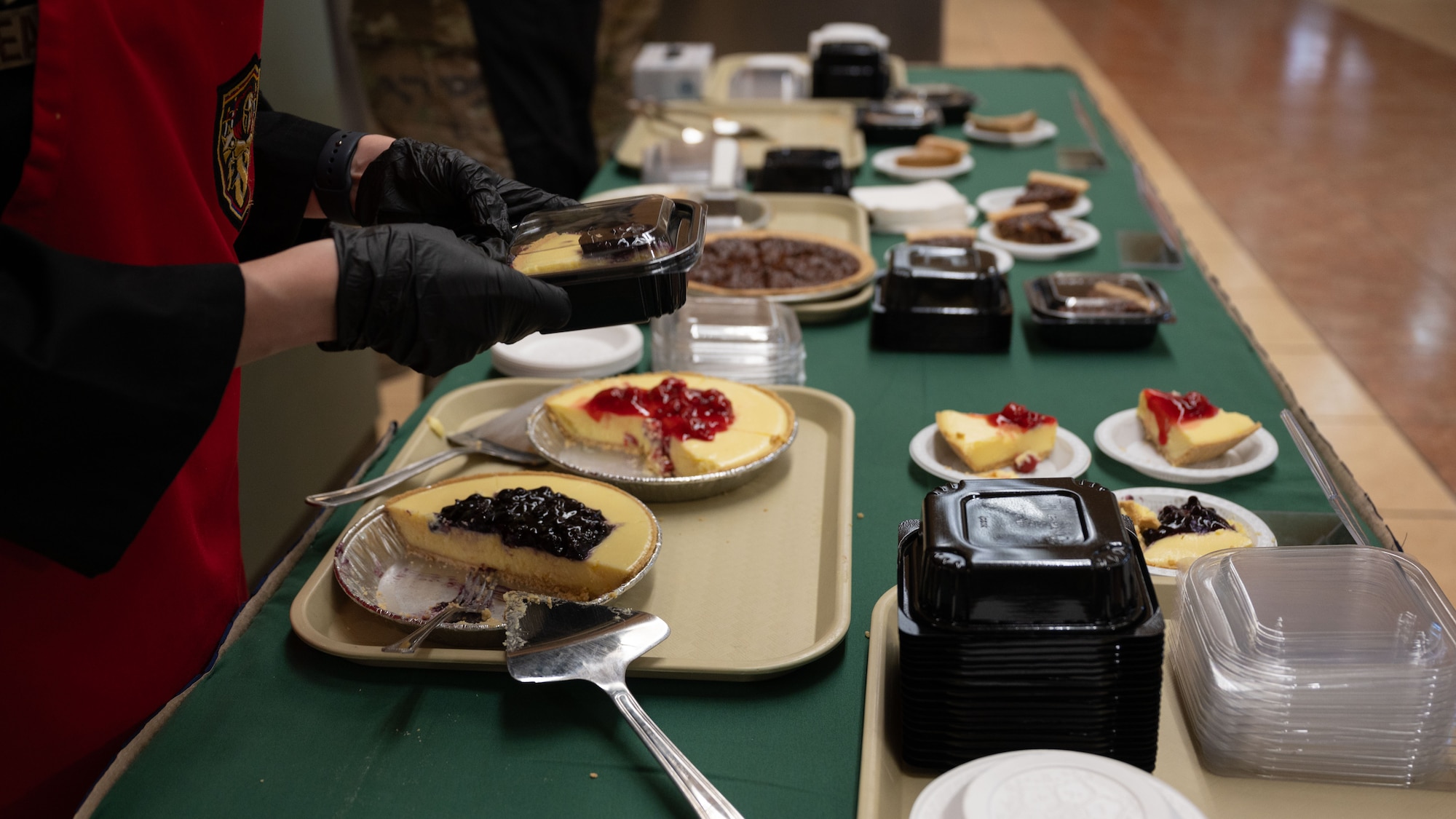 A U.S. Air Force Airmen assigned to the 51st Force Support Squadron, packages desserts at Osan Air Base, Republic of Korea, Nov. 27, 2025. Sharing a holiday environment provided an opportunity for reflection, connection and support during overseas service. (U.S. Air Force photo by Senior Airman Rome Bowermaster)