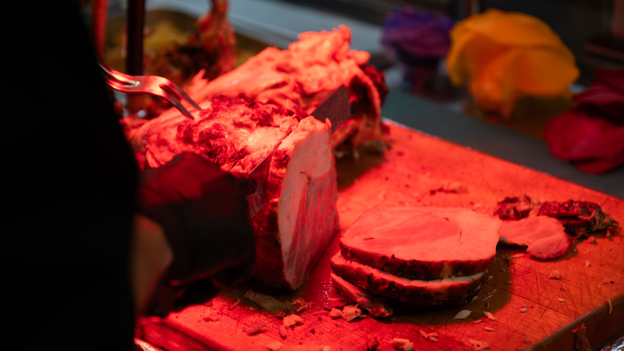U.S. Air Force Col. Ryan Ley, 51st Fighter Wing commander, slices turkey during a Thanksgiving meal at Osan Air Base, Republic of Korea, Nov. 27, 2025. Leadership engagement during holiday meals highlights the wing’s commitment to caring for Airmen while maintaining mission focus. (U.S. Air Force photo by Senior Airman Rome Bowermaster)