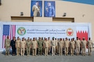MANAMA, Bahrain (Dec. 1, 2025) His Royal Highness Prince Salman bin Hamad Al-Khalifa, Crown Prince, Deputy Supreme Commander and Prime Minister of Bahrain, and U.S. Navy Adm. Brad Cooper, commander of U.S. Central Command, pose for a group photo at the Combine Command Post at Ras Al Bar Camp. The event marked the opening of a new Combined Command Post for air defense staffed by Bahrain and U.S. forces.  (U.S. Navy photo by Mass Communication Specialist 2nd Class Lindsay Lair)