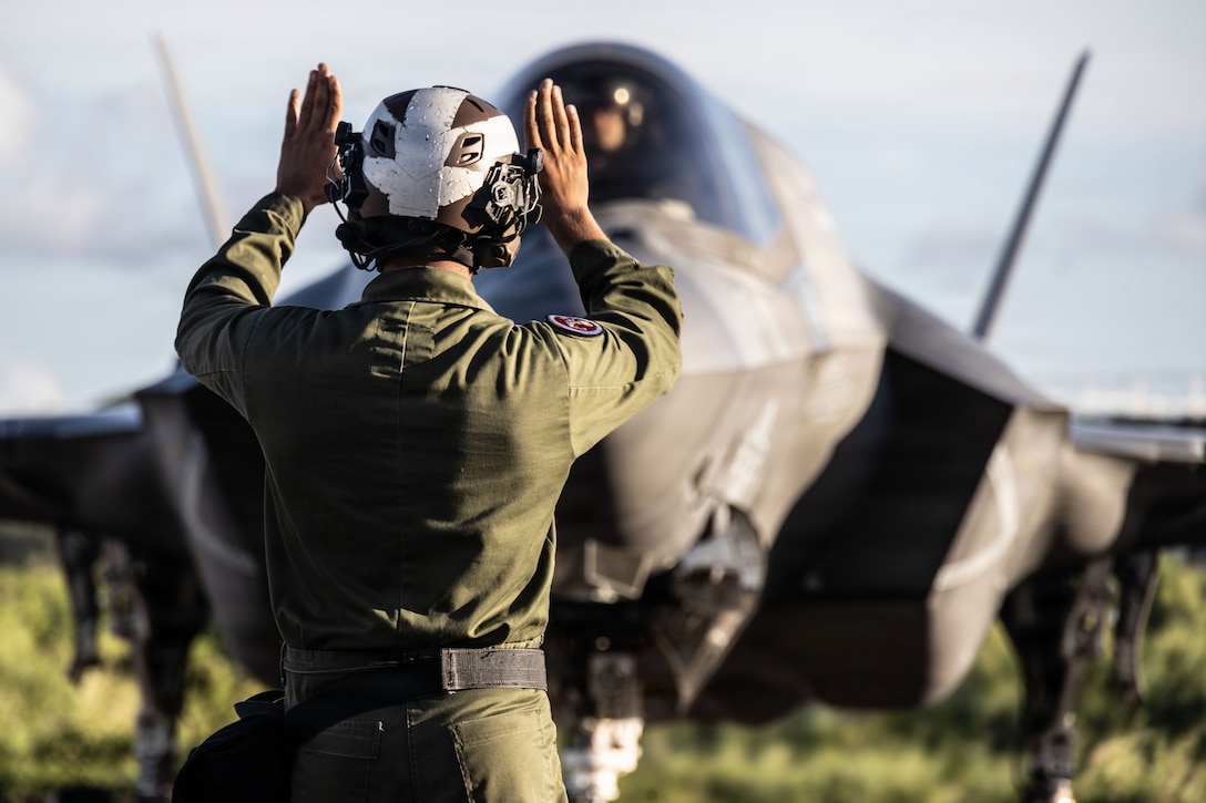 A U.S. Marine Corps plane captain with Marine Fighter Attack Squadron (VMFA) 225, U.S. Marine Corps Forces South, guides a U.S. Marine Corps F-35B Lightning II pilot with VMFA-225 at Jose Aponte de la Torre Airport in Ceiba, Puerto Rico, Nov. 20, 2025. U.S. military forces are deployed to the Caribbean in support of the U.S. Southern Command mission, Department of War-directed operations, and the president’s priorities to disrupt illicit drug trafficking and protect the homeland. (U.S. Marine Corps photo)