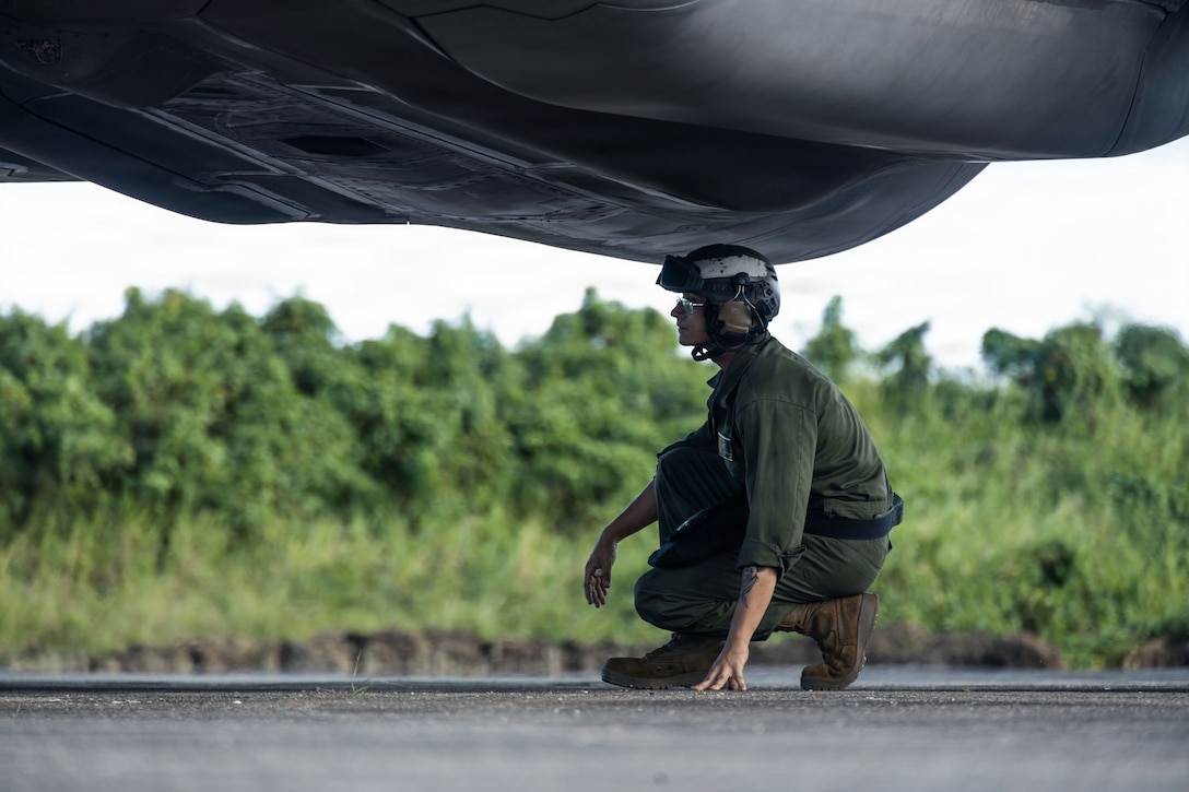 A U.S. Marine Corps plane captain with Marine Fighter Attack Squadron (VMFA) 225, U.S. Marine Corps Forces South, conducts a preflight inspection under a U.S. Marine Corps F-35B Lightning II assigned to VMFA-225 at Jose Aponte de la Torre Airport in Ceiba, Puerto Rico, Nov. 20, 2025. U.S. military forces are deployed to the Caribbean in support of the U.S. Southern Command mission, Department of War-directed operations, and the president’s priorities to disrupt illicit drug trafficking and protect the homeland. (U.S. Marine Corps photo)