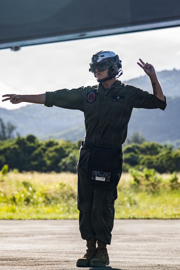 A U.S. Marine Corps plane captain with Marine Fighter Attack Squadron (VMFA) 225, U.S. Marine Corps Forces South, signals to a U.S. Marine Corps F-35B Lightning II pilot with VMFA-225 at Jose Aponte de la Torre Airport in Ceiba, Puerto Rico, Nov. 20, 2025. U.S. military forces are deployed to the Caribbean in support of the U.S. Southern Command mission, Department of War-directed operations, and the president’s priorities to disrupt illicit drug trafficking and protect the homeland. (U.S. Marine Corps photo)