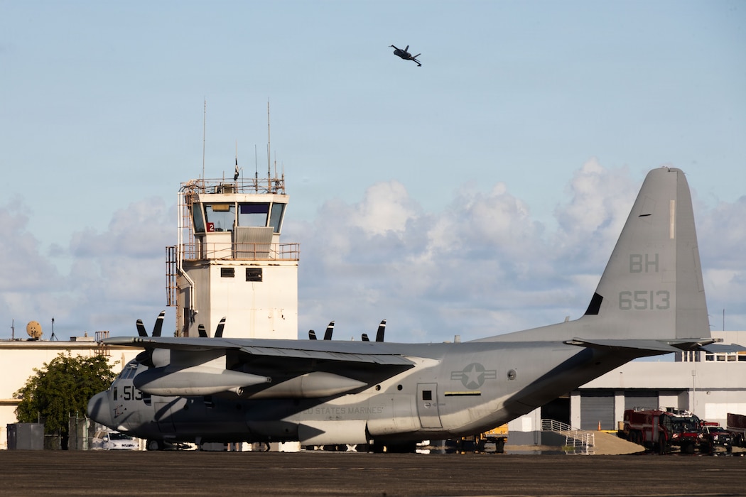 A U.S. Marine Corps KC-130J Super Hercules assigned to Marine Aerial Refueler Transport Squadron (VMGR) 252, Marine Aircraft Group 14, 2nd Marine Aircraft Wing, is parked on the flightline while a U.S. Marine Corps F-35B Lightning II assigned to Marine Fighter Attack Squadron (VMFA) 225, U.S. Marine Corps Forces, South, takes off at Jose Aponte de la Torre Airport in Ceiba, Puerto Rico, Nov. 20, 2025. U.S. military forces are deployed to the Caribbean in support of the U.S. Southern Command mission, Department of War-directed operations, and the president’s priorities to disrupt illicit drug trafficking and protect the homeland. (U.S. Marine Corps photo)