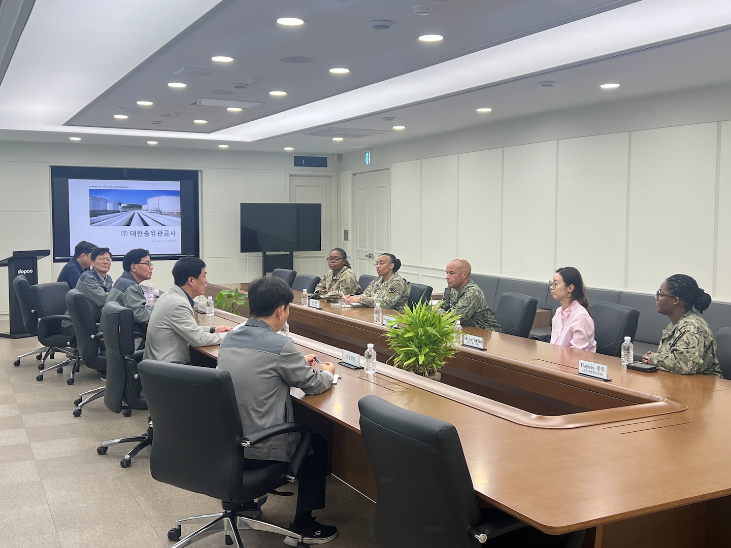 Industry partners brief RDML Bresnihan (center right) about pipeline operations that support DLA Energy Korea and ensure warfighters’ fuel requirements are met.