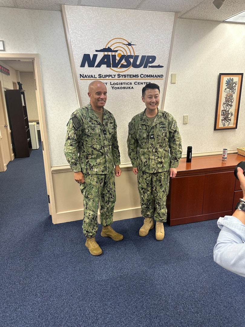 RDML Bresnihan (left) meets with Navy Capt. Frank Kim, commander of Fleet Logistics Center Yokosuka, to discuss operational support and fuel requirements.