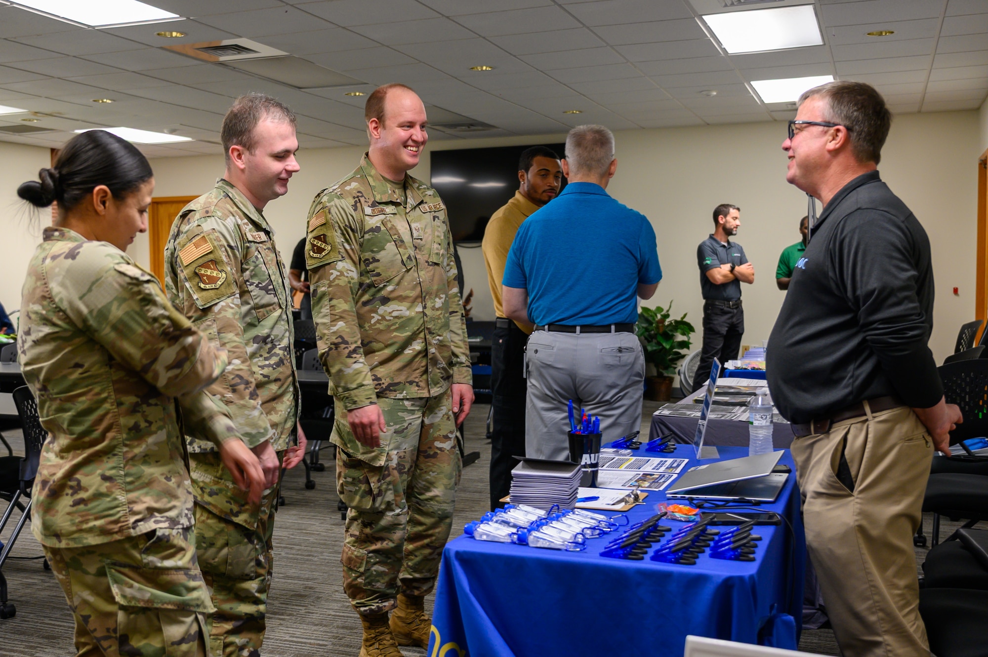 Senior Airman Evan Porter, 42d Air Base Wing Public Affairs journeyman, speaks with representatives from Alabama Ag Credit at the Military and Family Readiness Center career fair at Maxwell Air Force Base, Alabama, Nov. 25, 2025. The quarterly M&FRC career fairs help Airmen separating from the U.S. Air Force find employment at local companies and government agencies. (U.S. Air Force photo by Senior Airman Evan Lichtenhan)