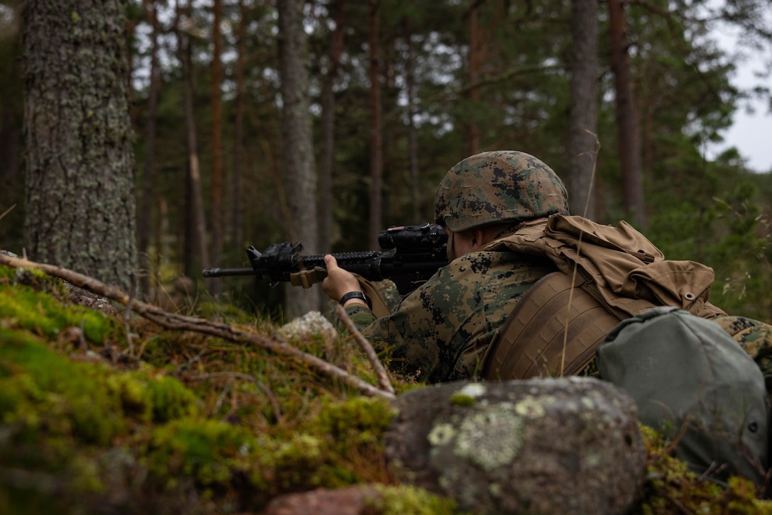 U.S. Marine Corps Sgt. Austin Norris, a motor transportation operator with Combat Logistics Battalion 6, Combat Logistics Regiment 2, 2nd Marine Logistics Group, holds a secured position during Exercise Freezing Winds 2025 in Gylto, Finland, Nov. 30, 2025. While deployed, Marines provide security to ensure the safety of key checkpoints and fellow Marines Freezing Winds is conducted to increase interoperability between Marines, Finland, and NATO Allies by executing combined amphibious operations in and around the Baltic Sea littorals, and is part of a regularly occurring series of exercises in northern Europe that demonstrates the capability to deploy and train Marines and Sailors in support of the NATO Alliance. Norris is a native of Oklahoma. (U.S. Marine Corps photo by Lance Cpl. Brady V. Hathaway)