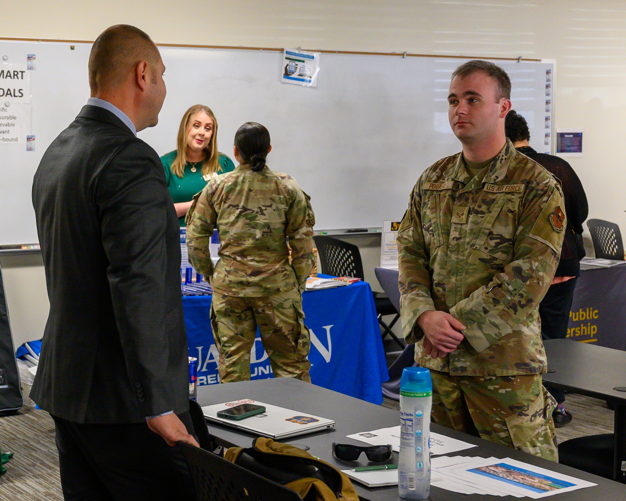 Senior Airman Evan Porter, 42d Air Base Wing Public Affairs journeyman, speaks with representatives from Alabama Ag Credit at the Military and Family Readiness Center career fair at Maxwell Air Force Base, Alabama, Nov. 25, 2025. The quarterly M&FRC career fairs help Airmen separating from the U.S. Air Force find employment at local companies and government agencies. (U.S. Air Force photo by Senior Airman Evan Lichtenhan)