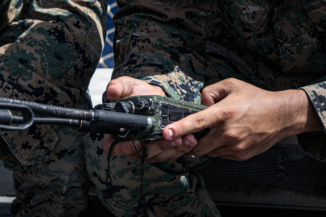 CARIBBEAN SEA – A U.S. Marine with the 22nd Marine Expeditionary Unit (Special Operations Capable) operates a radio during a communications check aboard Wasp-class amphibious assault ship USS Iwo Jima (LHD 7) while underway in the Caribbean Sea, Nov. 16, 2025. U.S. military forces are deployed to the Caribbean in support of the U.S. Southern Command mission, Department of War-directed operations, and the president’s priorities to disrupt illicit drug trafficking and protect the homeland. (U.S. Marine Corps photo)