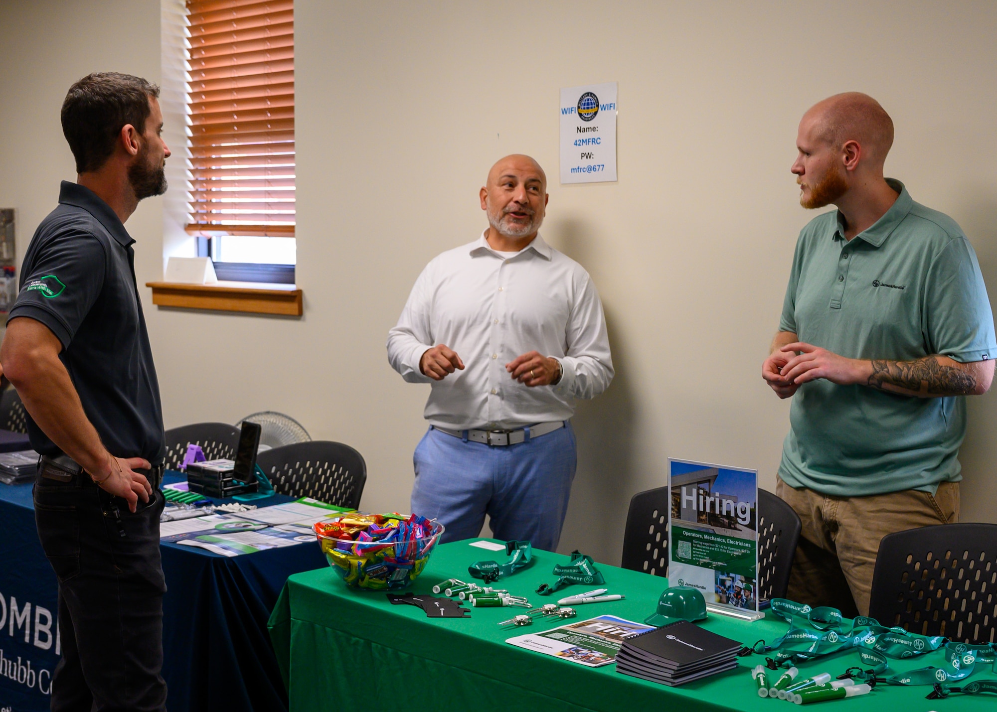Senior Airman Evan Porter, 42d Air Base Wing Public Affairs journeyman, speaks with representatives from Alabama Ag Credit at the Military and Family Readiness Center career fair at Maxwell Air Force Base, Alabama, Nov. 25, 2025. The quarterly M&FRC career fairs help Airmen separating from the U.S. Air Force find employment at local companies and government agencies. (U.S. Air Force photo by Senior Airman Evan Lichtenhan)