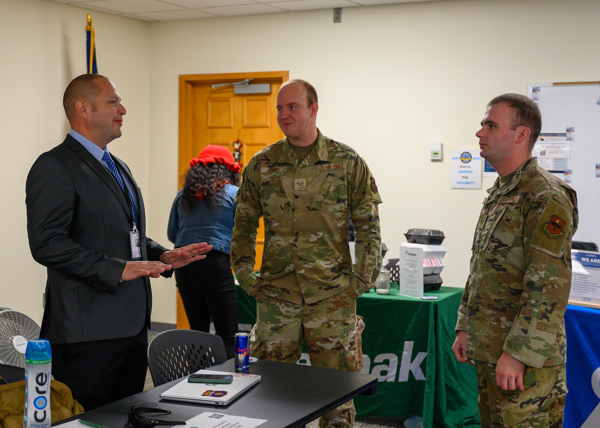 Senior Airman Evan Porter, 42d Air Base Wing Public Affairs journeyman, speaks with representatives from Alabama Ag Credit at the Military and Family Readiness Center career fair at Maxwell Air Force Base, Alabama, Nov. 25, 2025. The quarterly M&FRC career fairs help Airmen separating from the U.S. Air Force find employment at local companies and government agencies. (U.S. Air Force photo by Senior Airman Evan Lichtenhan)