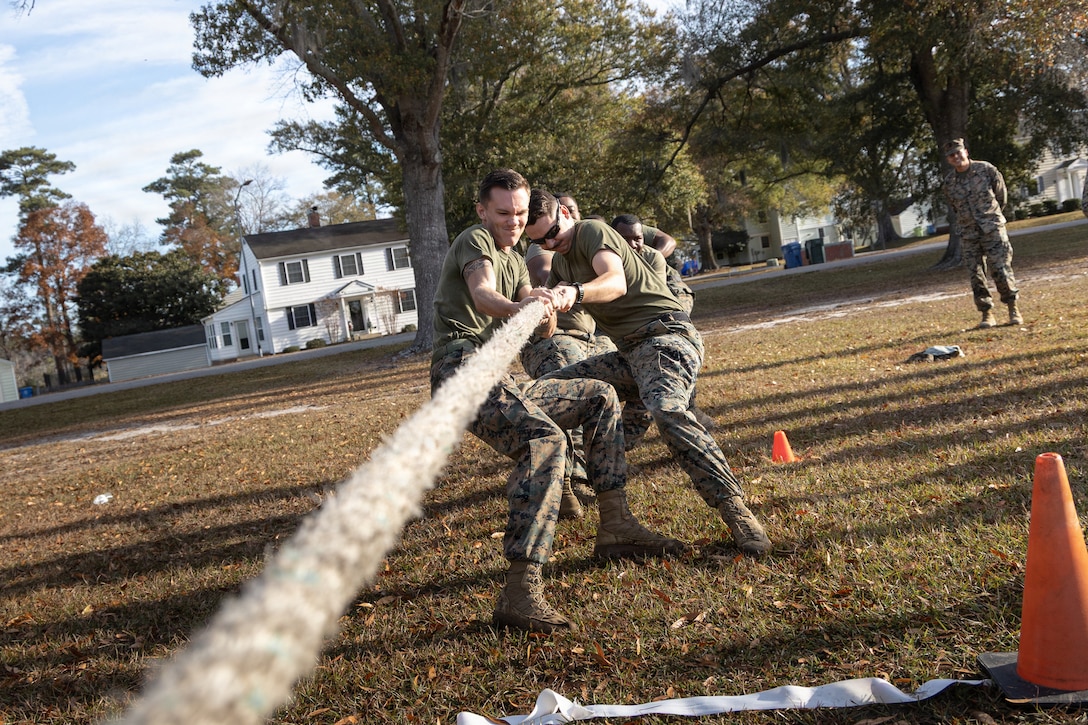 U.S. Marines with the 26th Marine Expeditionary Unit compete in a tug-of-war event during a field meet at Marine Corps Base Camp Lejeune, North Carolina, Nov. 25, 2025. The field meet brought 26th MEU Marines and Sailors together with various athletic events promoting competition, cohesion, and physical fitness within the unit. (U.S. Marine Corps photo by Cpl. Osmar VasquezHernandez)