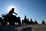 U.S. Air Force Airmen assigned to the 902d Security Forces Squadron park their all-terrain vehicles during an ATV training course at Joint Base San Antonio-Randolph, Texas, Sept. 30, 2025. The defenders demonstrated their understanding of proper vehicle operation by driving the ATVs in designated patterns and responding appropriately to instructor signals. (U.S. Air Force photo by Kathryn R.C. Reaves)