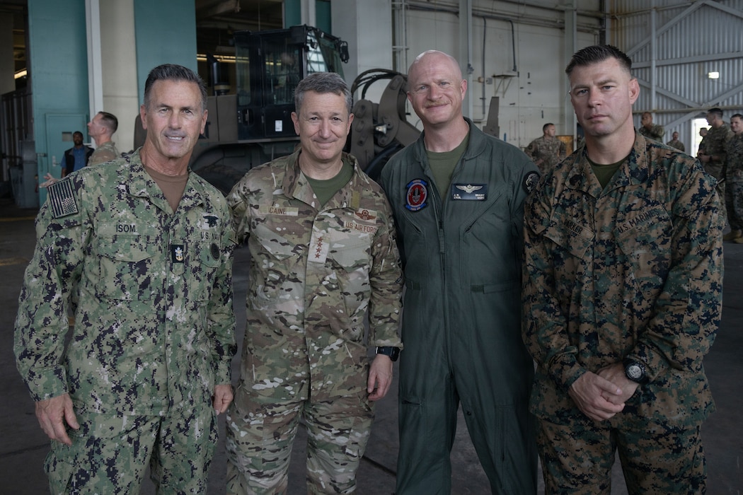 (From left to right) Senior Enlisted Advisor to the Chairman David L. Isom, Chairman of the Joint Chiefs of Staff Gen. Dan Caine, the Commanding Officer and the Command Senior Enlisted Leader of Marine Fighter Attack Squadron (VMFA) 225, U.S. Marine Corps Forces, South, pose for a photo Jose Aponte de la Torre Airport in Ceiba, Puerto Rico, Nov. 24, 2025. U.S. military forces are deployed to the Caribbean in support of the U.S. Southern Command mission, Department of War-directed operations, and the president’s priorities to disrupt illicit drug trafficking and protect the homeland. (U.S. Marine Corps photo)