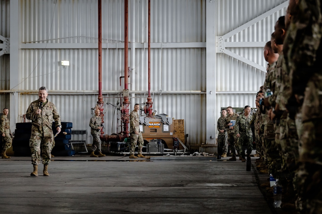 Chairman of the Joint Chiefs of Staff Gen. Dan Caine speaks to U.S. Marines with Marine Fighter Attack Squadron (VMFA) 225, U.S. Marine Corps Forces, South, and U.S. Airmen with the 346th Air Expeditionary Wing at Jose Aponte de la Torre Airport in Ceiba, Puerto Rico, Nov. 24, 2025. U.S. military forces are deployed to the Caribbean in support of the U.S. Southern Command mission, Department of War-directed operations, and the president’s priorities to disrupt illicit drug trafficking and protect the homeland. (U.S. Marine Corps photo)