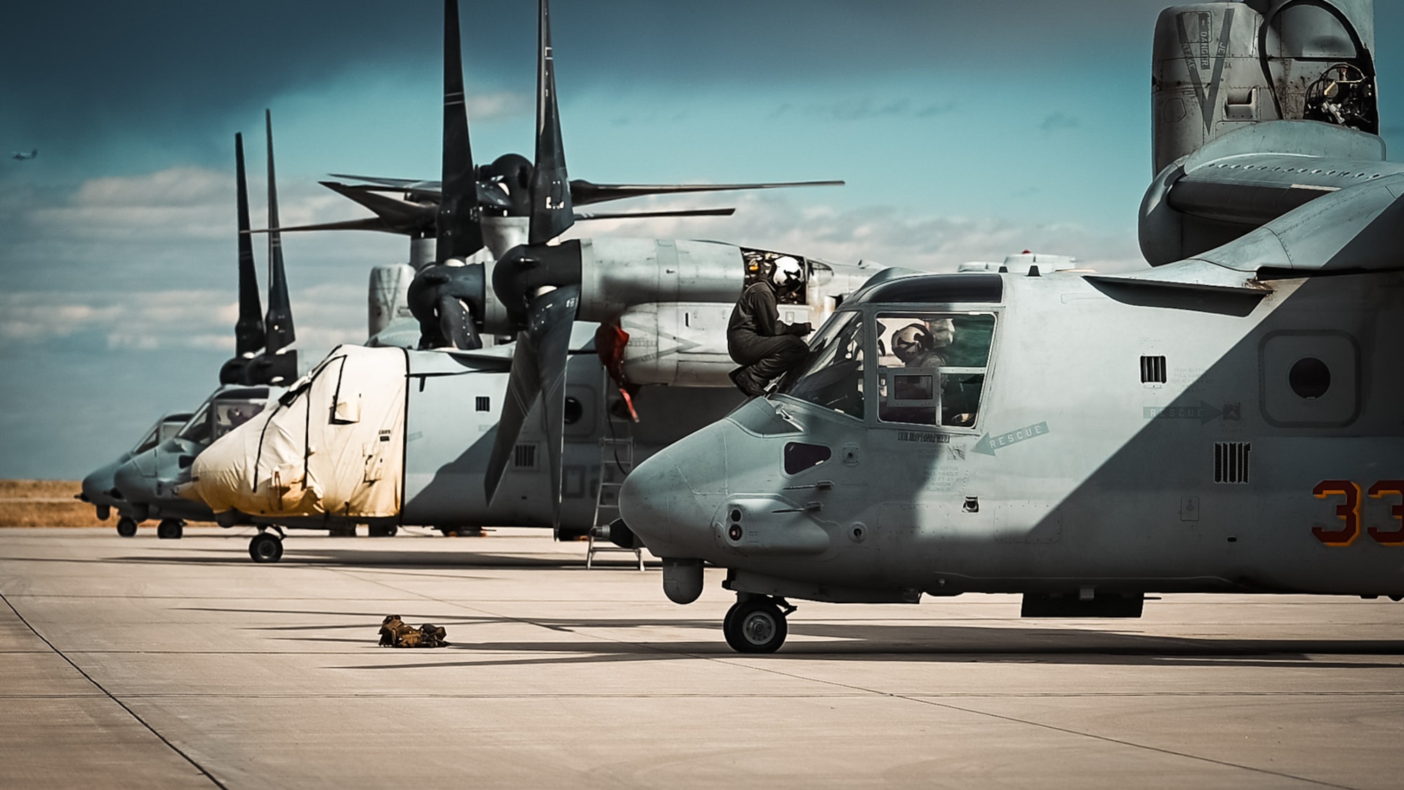 military aircraft sit on flightline