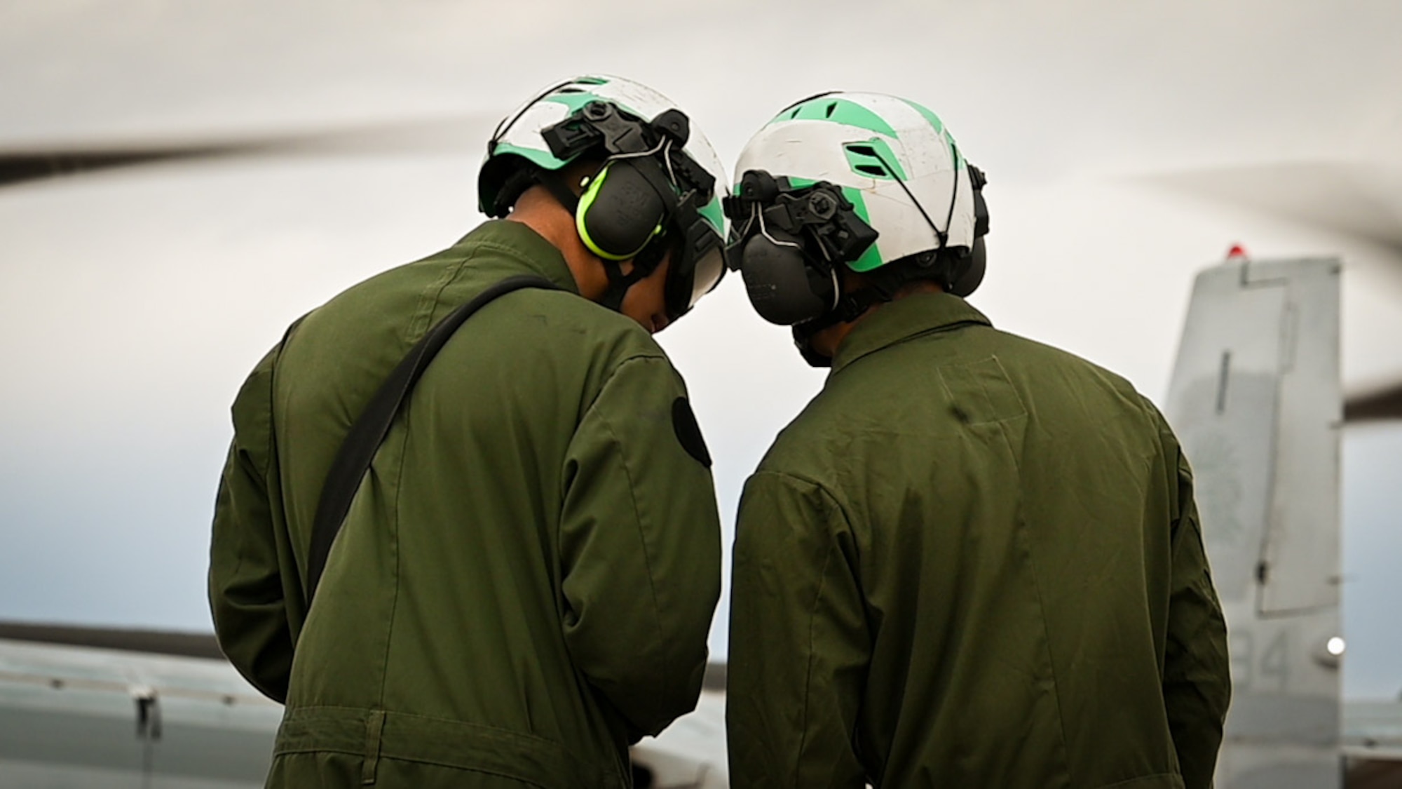 two pilots look at flight plans