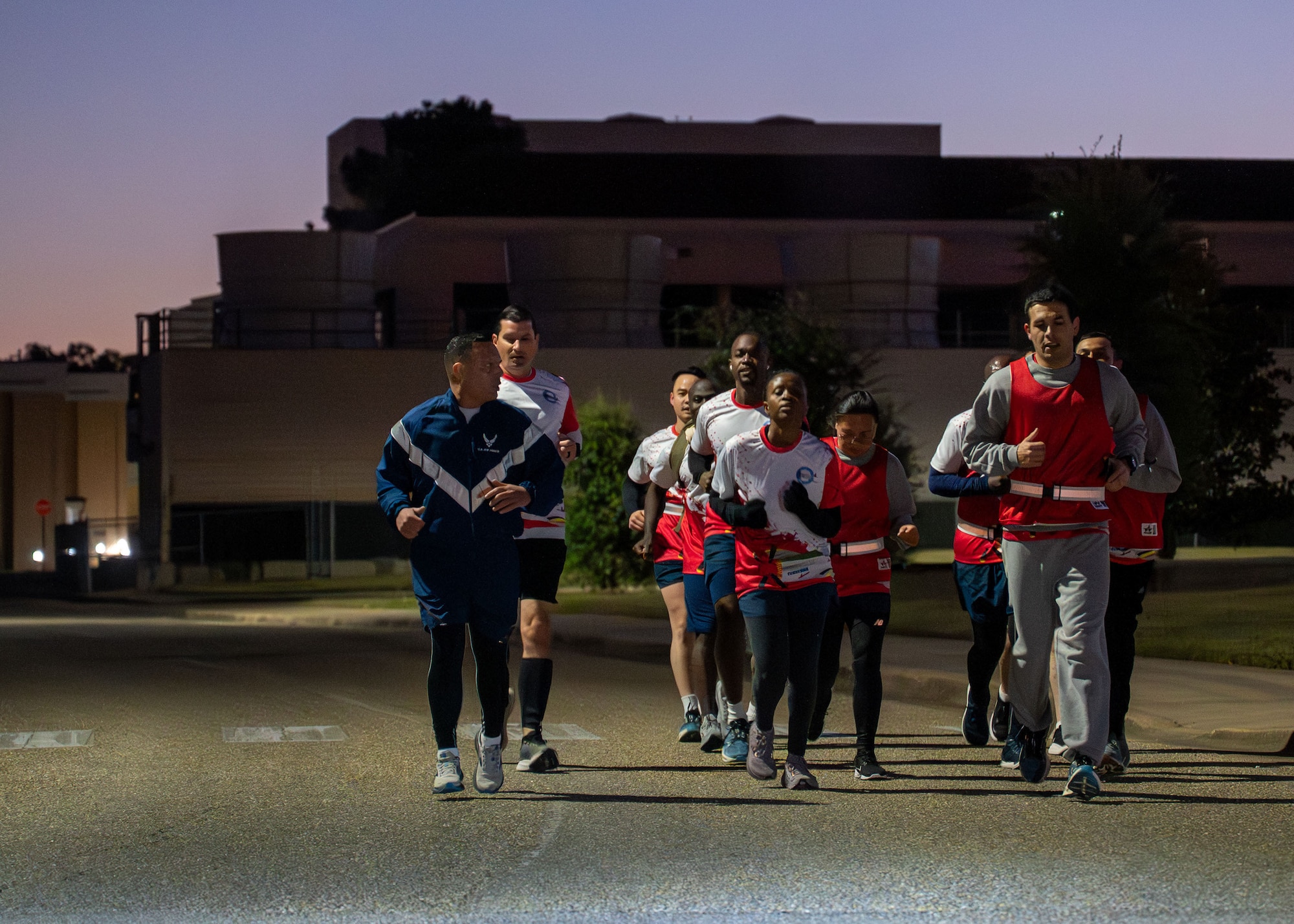 U.S. Air Force Col. Pedro E. Matos, far left, International Officer School commandant, runs with IOS students at Maxwell Air Force Base, Alabama, Oct. 24, 2025.