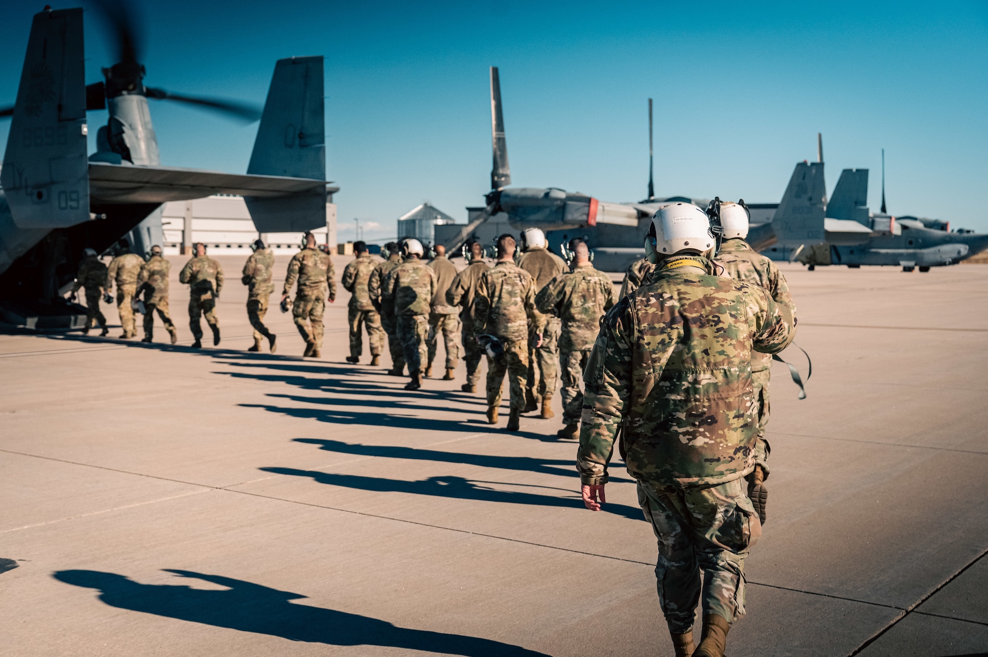 men walk to aircraft