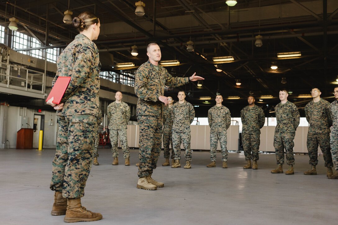 U.S. Marine Corps Sgt. Maj. Liam Williams, sergeant major of Marine Corps Base Quantico, addresses the audience during Sgt. Kayli Merritt’s, an expeditionary firefighting and rescue specialist with Marine Corps Air Facility, meritorious promotion to sergeant at MCAF, on MCB Quantico, Virginia, Nov. 24, 2025. A meritorious promotion is based on the individual Marines ability to take on the responsibilities and duties of a higher grade in an effective manner. (U.S. Marine Corps photo by Lance Cpl. Harleigh Faulk)