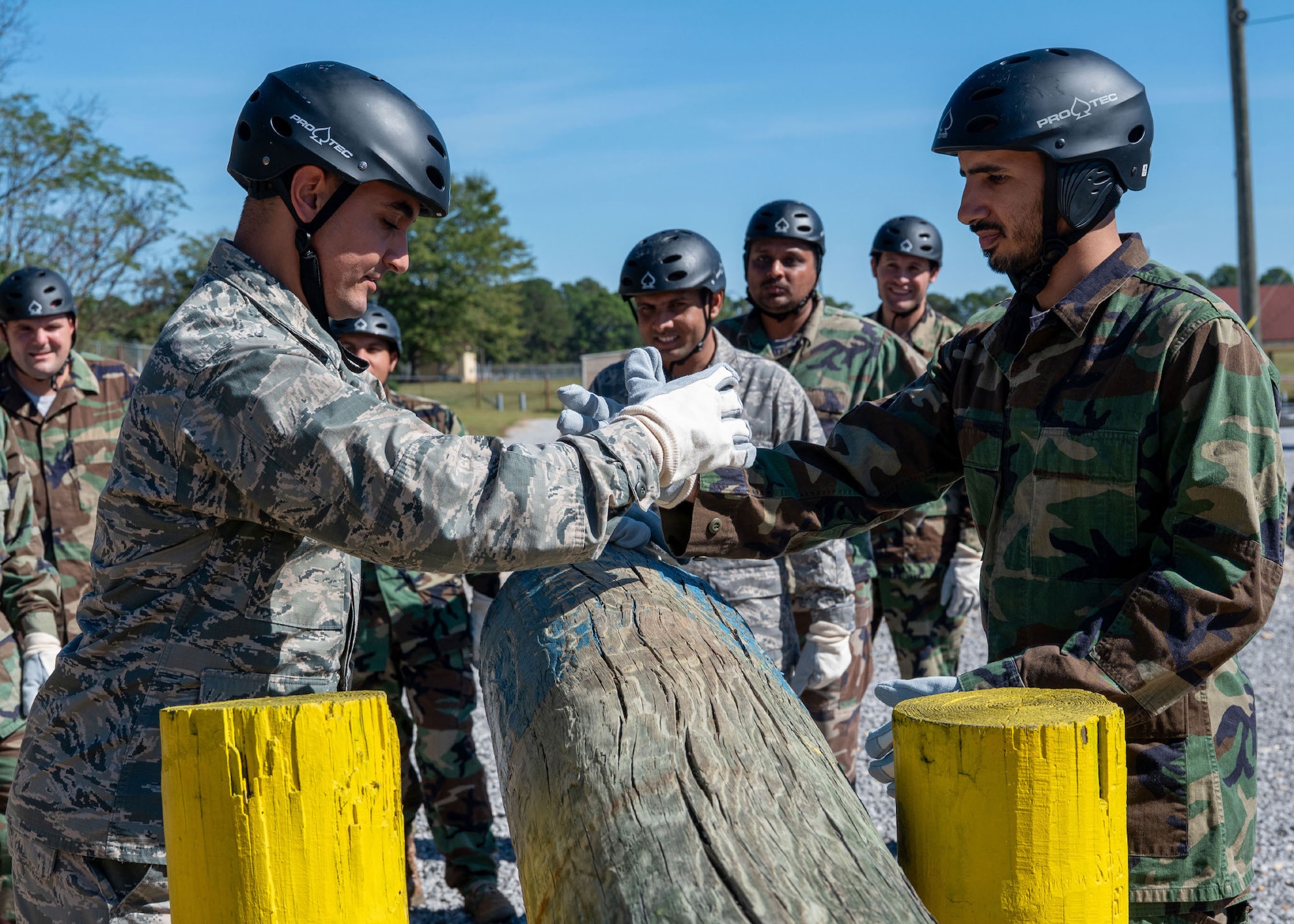 International Officer School students help each other through an obstacle course during a preparatory phase at Maxwell Air Force Base, Alabama, Oct. 23, 2025.