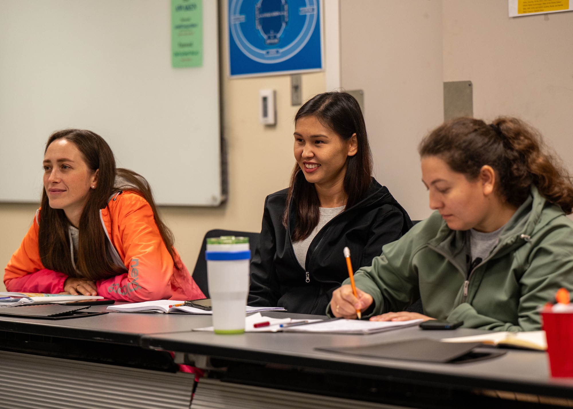 Svitlana Rak, left, Ulbossyn Shaimerdenova, center, Cristina Olari, right, international officer spouses, attend an International Dependents English Course at Maxwell Air Force Base, Alabama, Oct. 28, 2025.