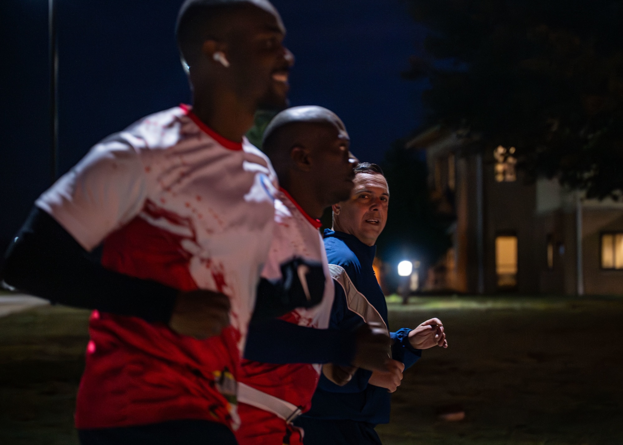 U.S. Air Force Col. Pedro E. Matos, right, International Officer School commandant, participates in an early morning run with international officer students at Maxwell Air Force Base, Alabama, Oct. 24, 2025.