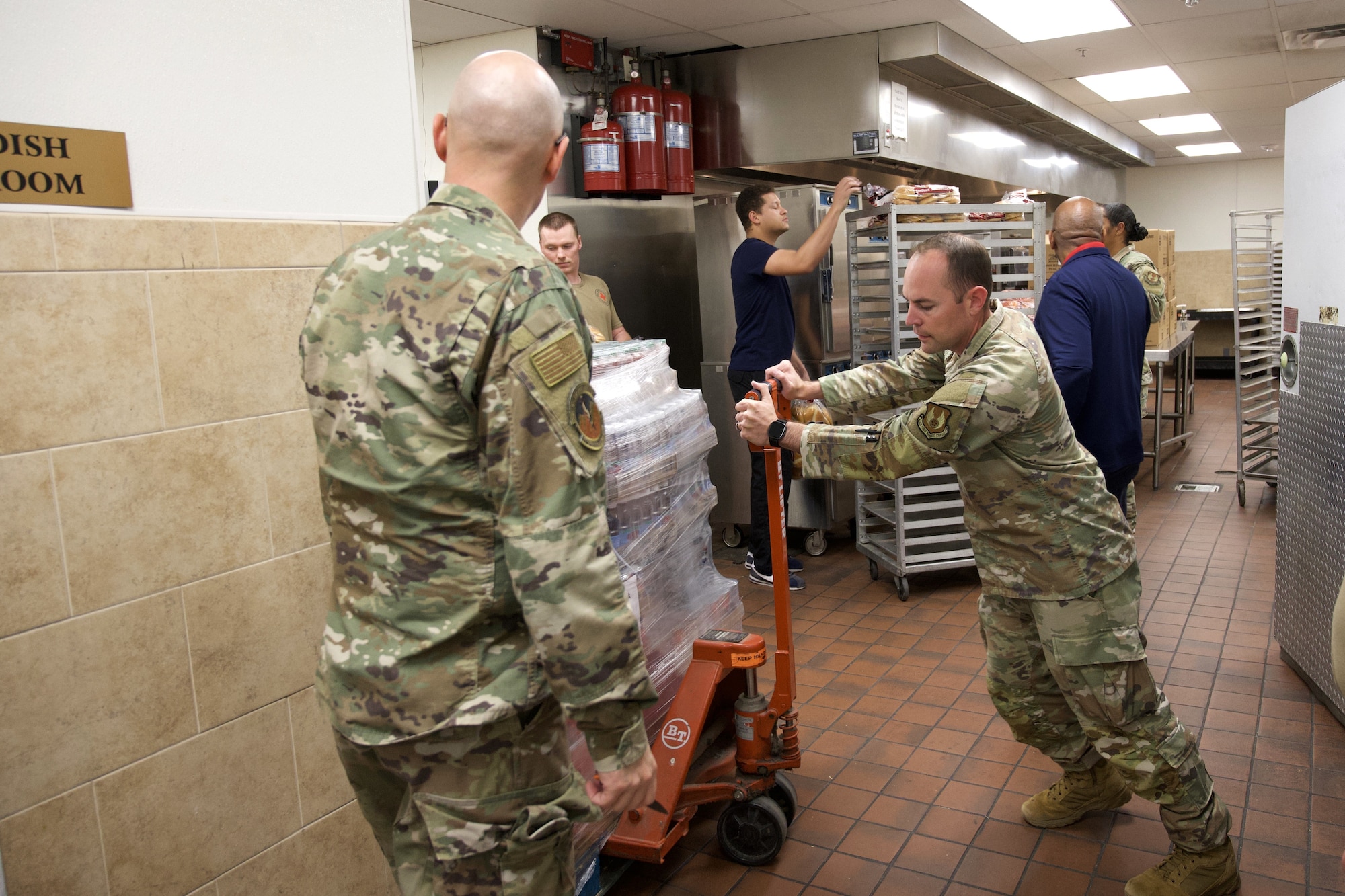 Volunteers unload supplies donated by the community.