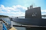 Cmdr. Bryan Chapman turned over charge of the Historic Ship Nautilus (HSN) and the Submarine Force Museum (SFM) to Lt. Commander Brian Lucas during a change of charge ceremony on the Museum’s Nautilus Pier. (U.S. Navy photo by Mass Communication Specialist 2nd Class Lucas J. Hastings)