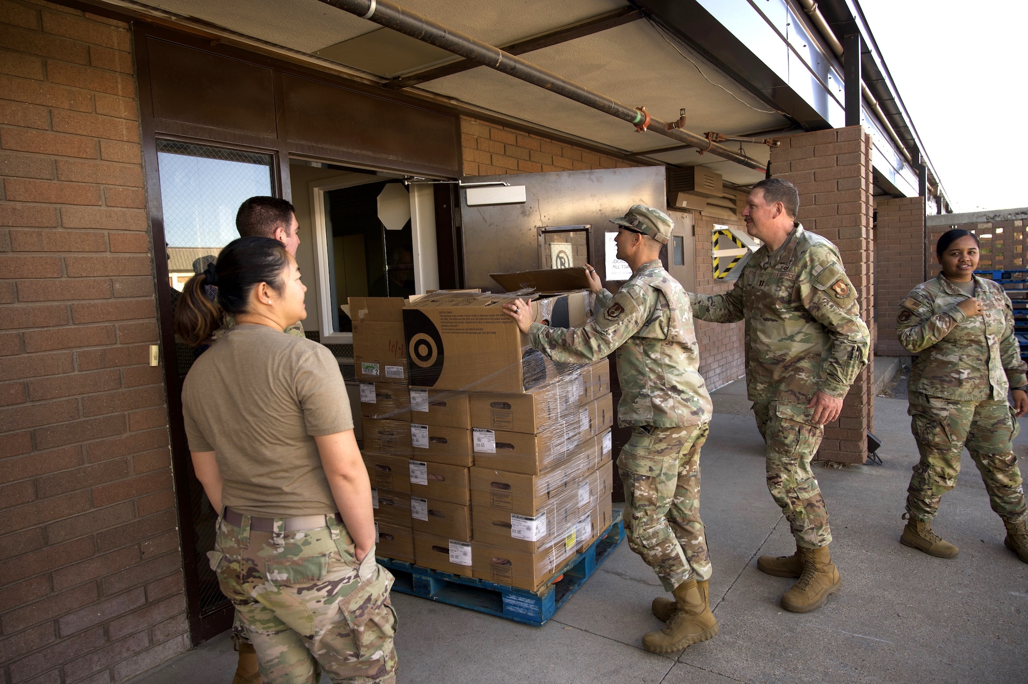 Volunteers unload food donation deliveries to support Hill AFB families and employees during the government shutdown.