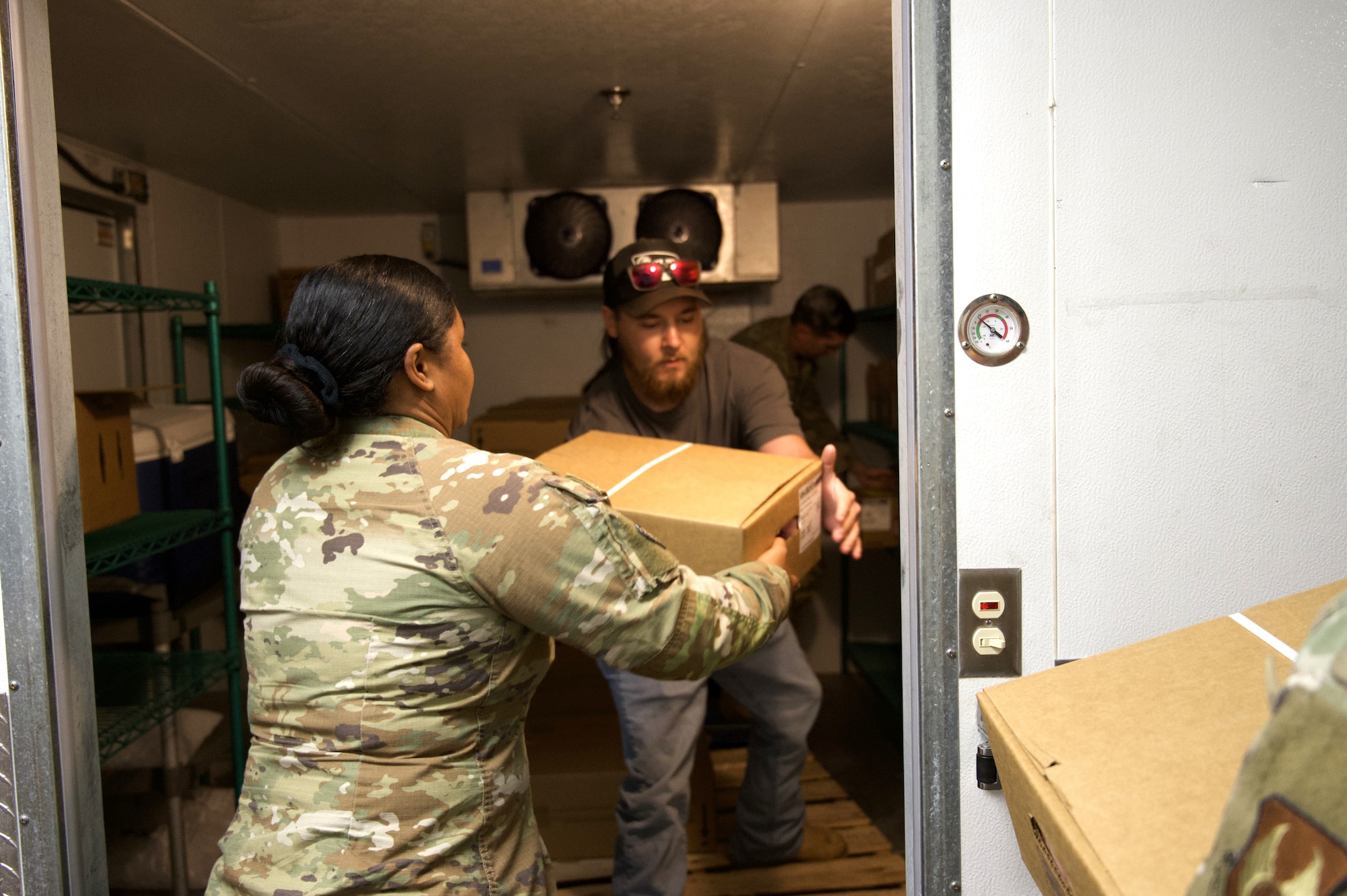 Volunteers unload supplies donated by the community.