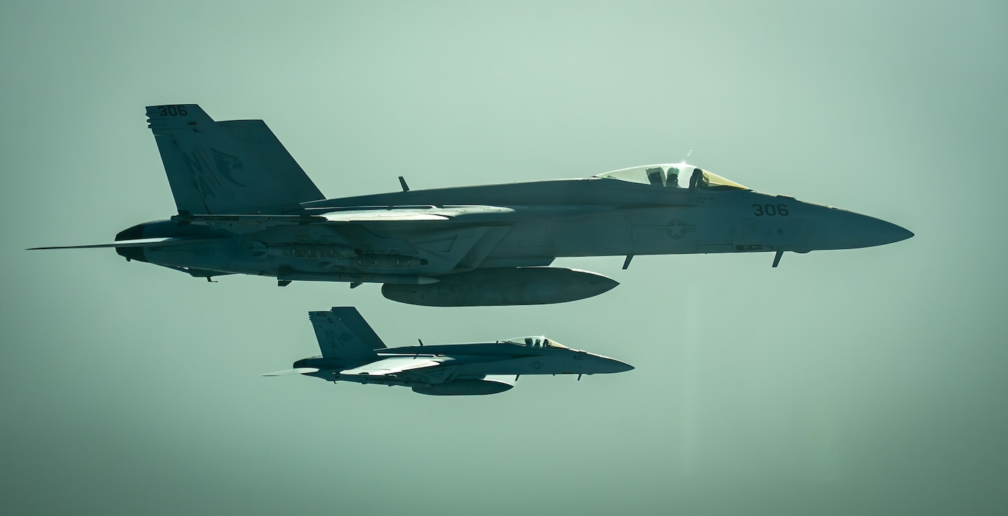A pair of U.S. Navy F/A-18E Super Hornets assigned to the Nimitz Carrier Strike Group conduct a combat air patrol over the U.S. Central Command area of responsibility, August 7, 2025