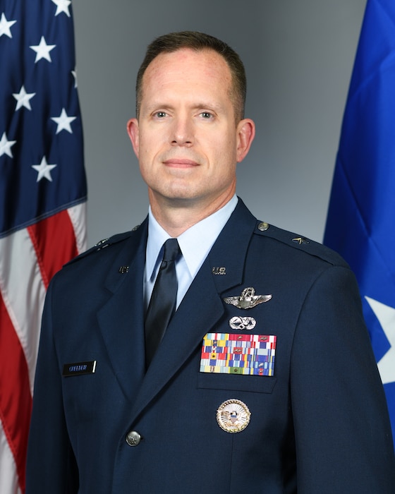 A military member stands for a portrait.