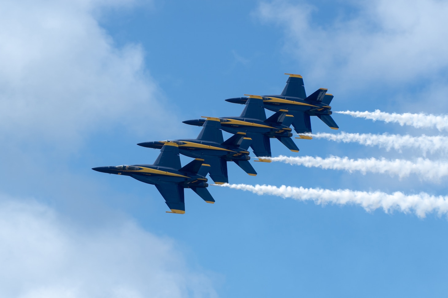The U.S. Navy Blue Angels perform a stunt as part of the 2022 Kaneohe Bay Air Show, Marine Corps Base Hawaii, Aug. 13th, 2022. As the U.S. Navy’s Flight Demonstration Squadron, the Blue Angels is comprised of several F/A-18 Super Hornets and one C-130J Hercules who perform aerobatics around the United States. The Kaneohe Bir Show, which contained aerial performances, static displays, demonstrations and vendors, was to express MCBH’s appreciation to the re