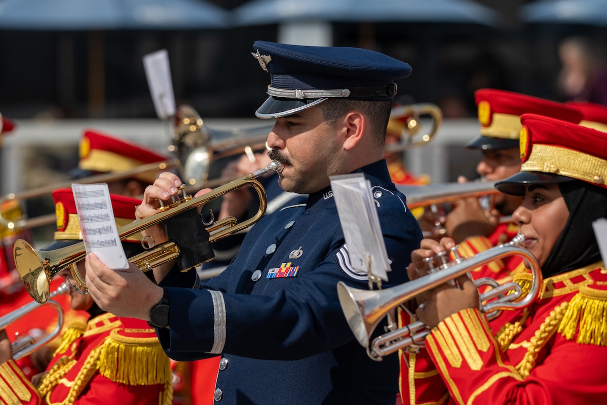 People playing instruments in uniform
