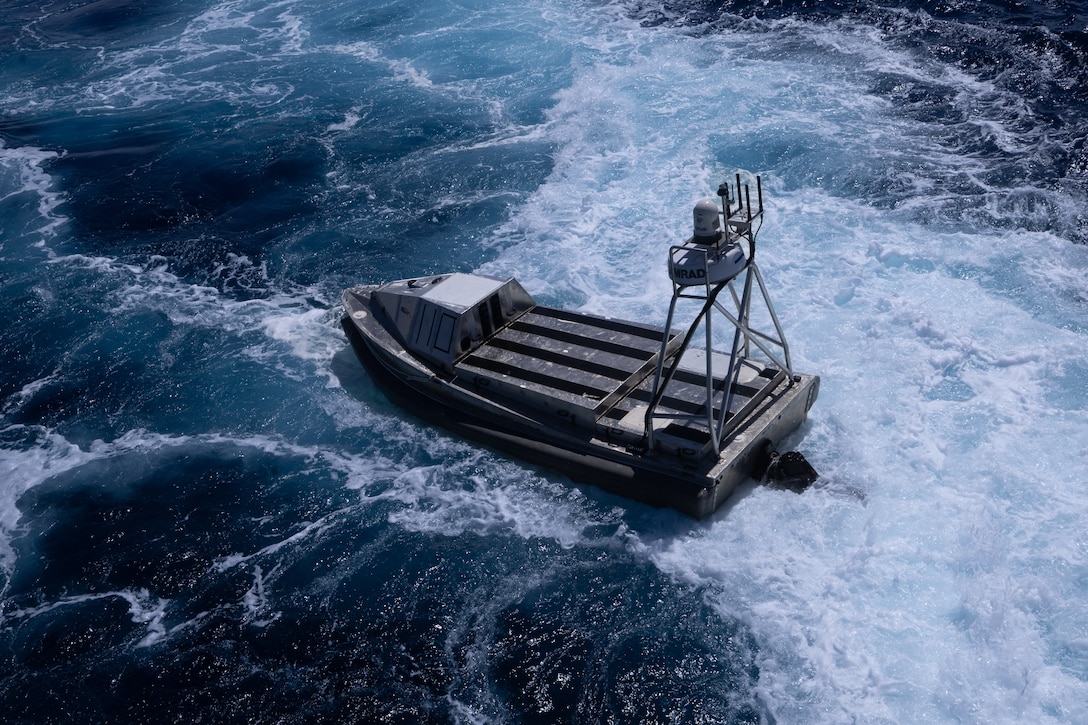 An autonomous craft moves in a choppy body of water