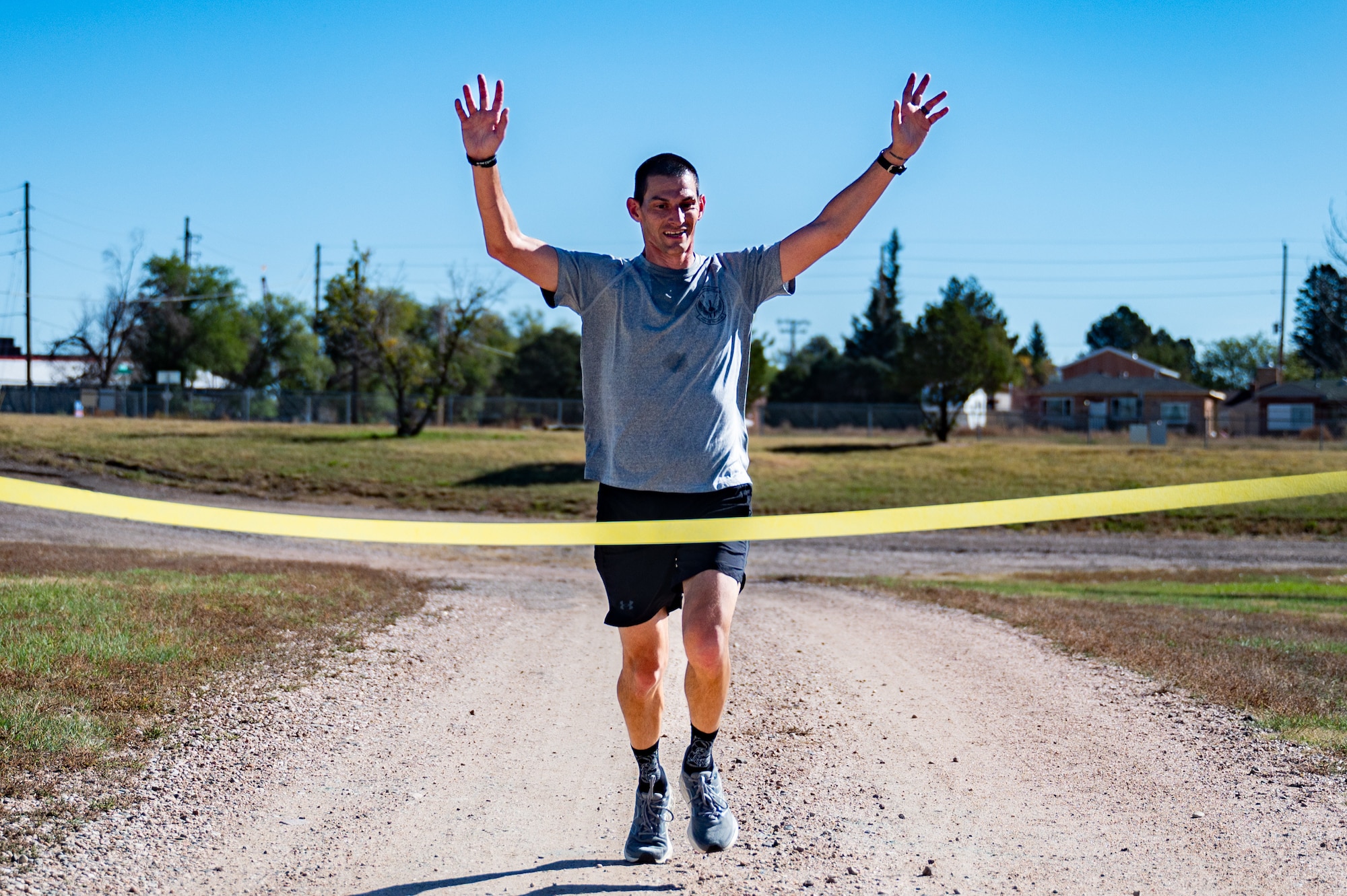 The 90th Missile Maintenance Squadron, along with 90 FSS, hosted a 5K to show support for Senior Airman Terrell Johnson’s daughter who recently beat cancer, participants were encouraged to wear yellow or dress as their favorite superhero. (U.S. Air Force photo by Airman Nicholas Rowe)
