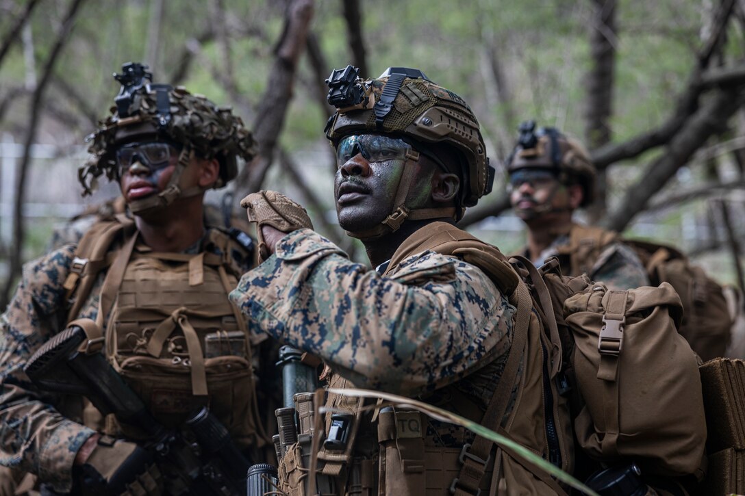U.S. Marine Corps Lance Cpl. Louis Demps, a rifleman with 3rd Littoral Combat Team, 3rd Marine Littoral Regiment, 3rd Marine Division, relays orders while executing platoon attack drills at Marine Corps Training Area Bellows, Hawaii, Nov. 21, 2025.