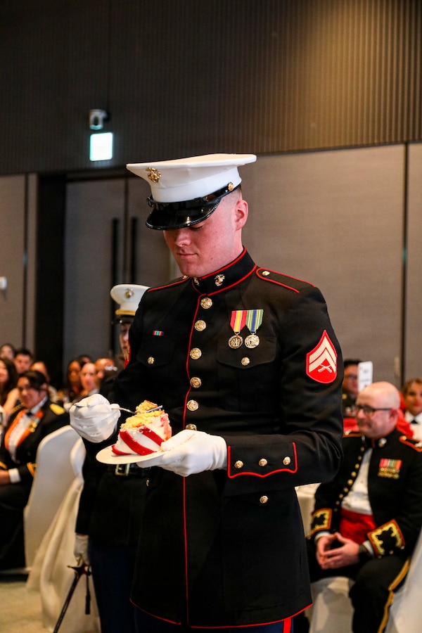 U.S. Marine Corps Cpl. Trent M. Crawford, a comptroller chief with United States Marine Corps Forces, Korea, takes the first bite of the birthday cake as the youngest Marine present during MARFORK’s 250th Marine Corps birthday ball in Seoul, South Korea, Nov. 21, 2025. Founded on November 10, 1775, the United States Marine Corps has served our nation honorably in every clime and place for 250 years. Throughout 2025, Marines across the globe will celebrate the 250th birthday of the Corps, commemorating service, sacrifice, and priding themselves on living ‘Semper Fidelis’ or ‘Always Faithful’ to their nation and to each other. (U.S. Army photo by PFC Oh Dong)