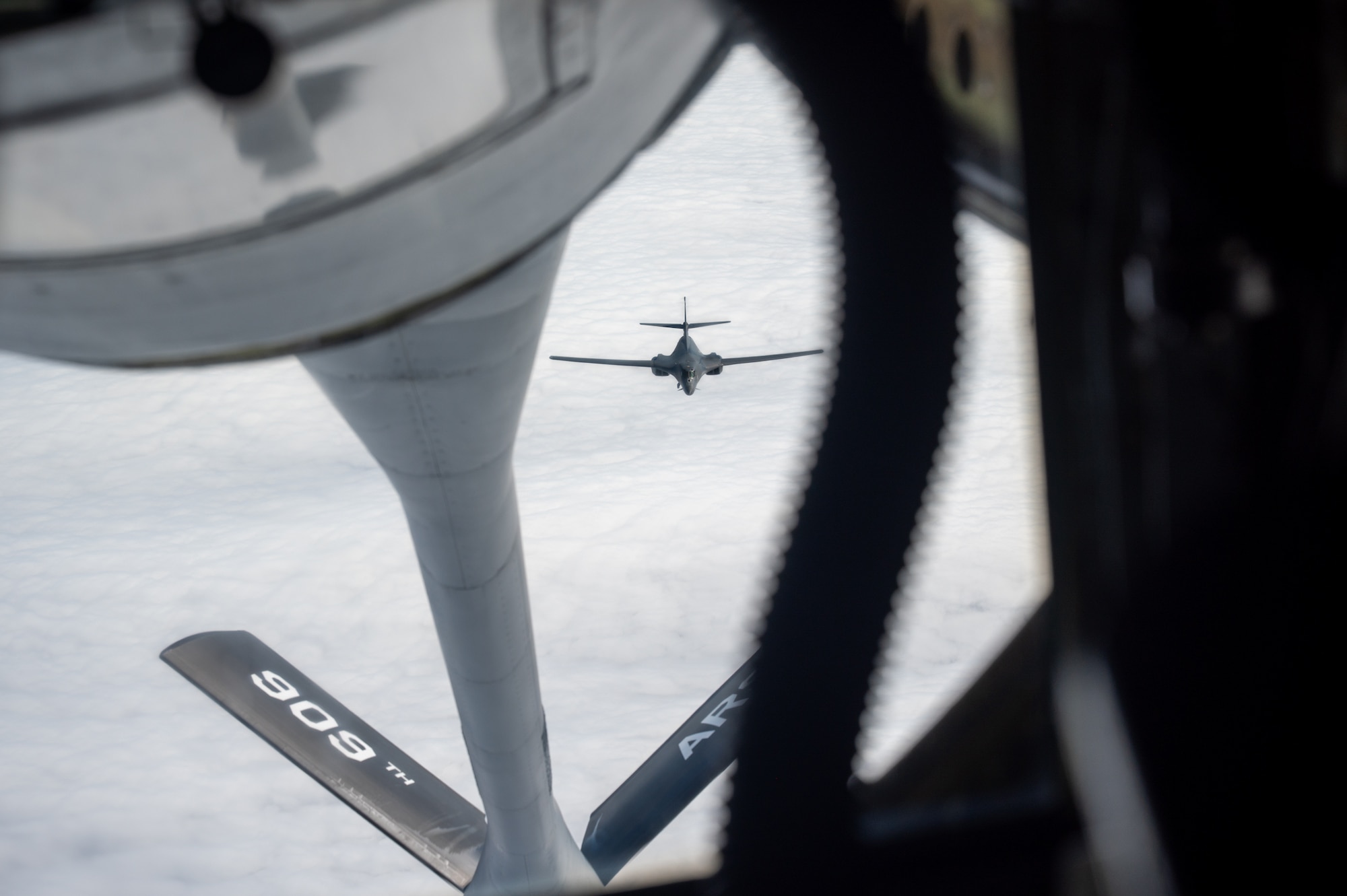 A U.S. Air Force B1-B Lancer approaches a KC-135 Stratotanker in preparation for mid air refueling.