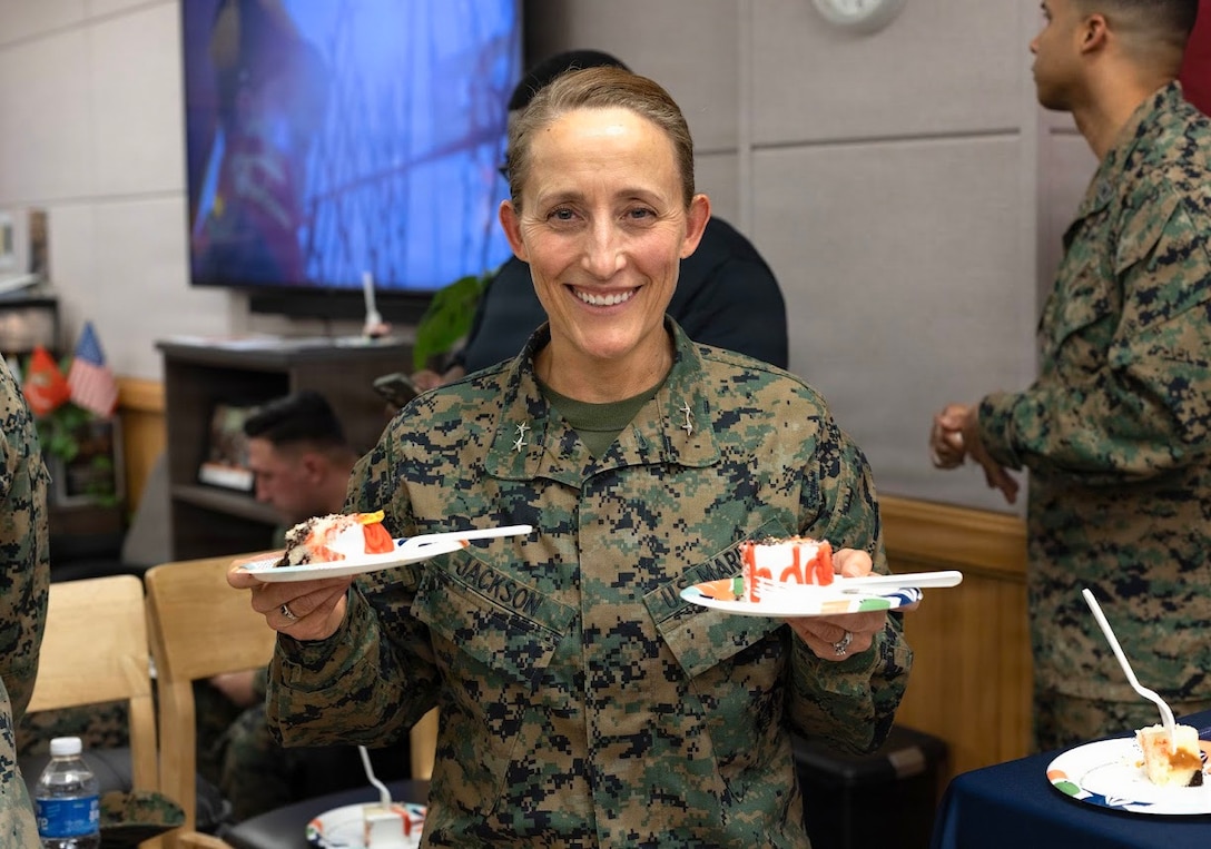 U.S. Marine Corps Maj. Gen. Valerie A. Jackson, commander of U.S. Marine Corps Forces, Korea, poses for a photo while handing out birthday cake during a U.S Marine Corps 250th birthday cake cutting ceremony at United Service Organizations on USAG Camp Humphrey’s, South Korea, Nov. 7, 2025. Founded on November 10, 1775, the United States Marine Corps has served our nation honorably in every clime and place for 250 years. Throughout 2025, Marines across the globe will celebrate the 250th birthday of the Corps, commemorating service, sacrifice, and priding themselves on living ‘Semper Fidelis’ or ‘Always Faithful’ to their nation and to each other. (U.S. Marine Corps photo by Cpl. Simon Saravia)