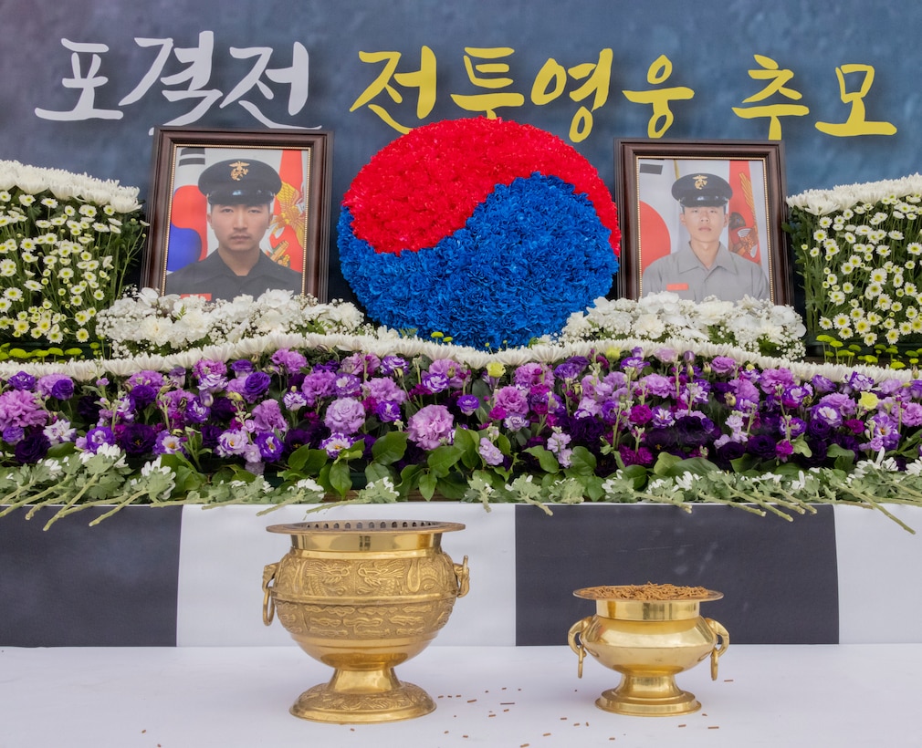 A memorial alter for Republic of Korea Marine Corps Staff Sgt. Suh Jung-woo and Pfc. Moon Gwang-woo is set during a memorial ceremony for the 15th anniversary of the Bombardment of Yeonpyeong to honor the fallen ROK Marines and their unwavering actions in defense of their country, on Nov. 23, 2025. On Nov. 23, 2010, upon receiving North Korean artillery fire on Yeonpyeong Island, ROK Marine Corps forces responded swiftly and decisively with artillery counterfire to successfully defend the island in what is known today as the Bombardment of Yeonpyeong. (U.S. Marine Corps photos by Cpl. Simon Saravia)