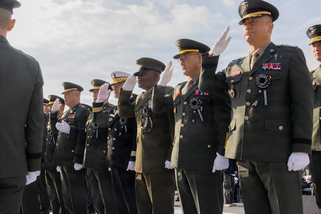 U.S. Marine Corps Sgt. Maj. Ismael G. Bamba, command senior enlisted leader of U.S. Marine Corps Forces Korea, renders a salute to fallen Republic of Korea Marines alongside ROK Marine Corps and Navy leaders during a memorial ceremony for the 15th anniversary of the Bombardment of Yeonpyeong to honor the fallen ROK Marines and their unwavering actions in defense of their country, on Nov. 23, 2025. On Nov. 23, 2010, upon receiving North Korean artillery fire on Yeonpyeong Island, ROK Marine Corps forces responded swiftly and decisively with artillery counterfire to successfully defend the island in what is known today as the Bombardment of Yeonpyeong. (U.S. Marine Corps photos by Cpl. Simon Saravia)