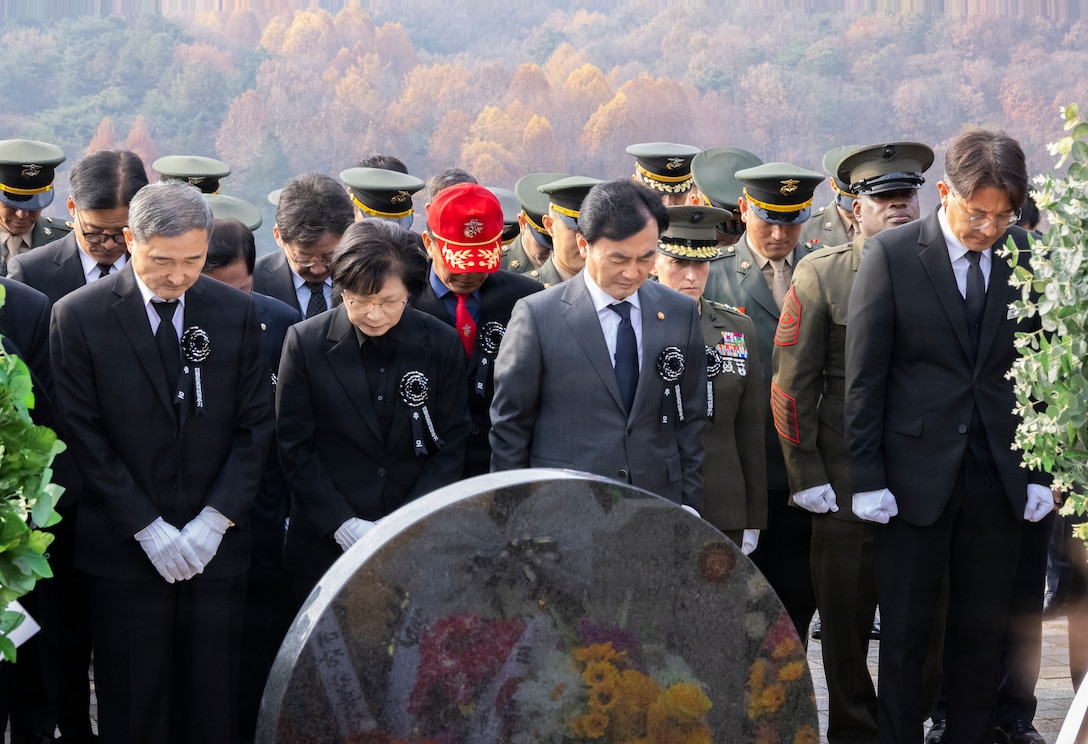 Families of fallen Republic of Korea Marines, Ahn Gyu-Back, the Republic of Korea Minister of National Defense, ROK service members, and U.S. Marines with U.S. Marine Corps Forces, Korea bow their heads for a moment of silence during a memorial ceremony for the 15th anniversary of the Bombardment of Yeonpyeong to honor the fallen ROK Marines and their unwavering actions in defense of their country, on Nov. 23, 2025. On Nov. 23, 2010, upon receiving North Korean artillery fire on Yeonpyeong Island, ROK Marine Corps forces responded swiftly and decisively with artillery counterfire to successfully defend the island in what is known today as the Bombardment of Yeonpyeong. (U.S. Marine Corps photos by Cpl. Simon Saravia)