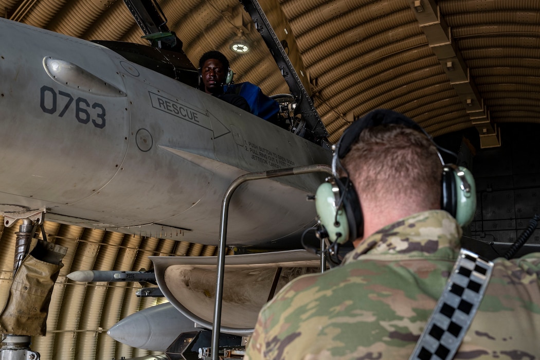 U.S. Air Force Senior Airman John Holt, left, and Staff Sgt. Jacob Johnson, 35th Fighter Generation Squadron dedicated crew chiefs, conduct a basic landing gear operational check out during Freedom Flag 25-2 at Kunsan Air Base, Republic of Korea, Nov. 4, 2025.